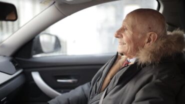 Elderly man with dementia riding in the car
